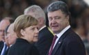 Poroşenko şi Merkel au discutat despre încălcarea planului de pace de la Donbas