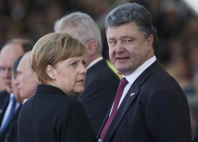 Poroenko i Merkel au discutat despre nclcarea planului de pace de la Donbas