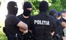 Poliţia efectuează percheziţii în Bucureşti şi în alte patru judeţe din ţară